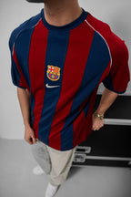 Vintage 2000-2001 Barcelona home jersey showcasing iconic blue and red Blaugrana stripes in a classic soccer design.