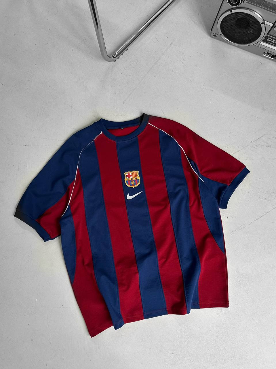 Vintage 2000-2001 Barcelona home jersey showcasing iconic blue and red Blaugrana stripes in a classic football design.