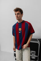 Classic 2000-2001 Barcelona home jersey showcasing iconic Blaugrana blue and red stripes in a timeless retro design.