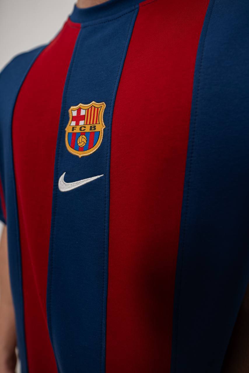 Classic 2000-2001 Barcelona home jersey showcasing iconic blue and red Blaugrana stripes in a vintage football design.