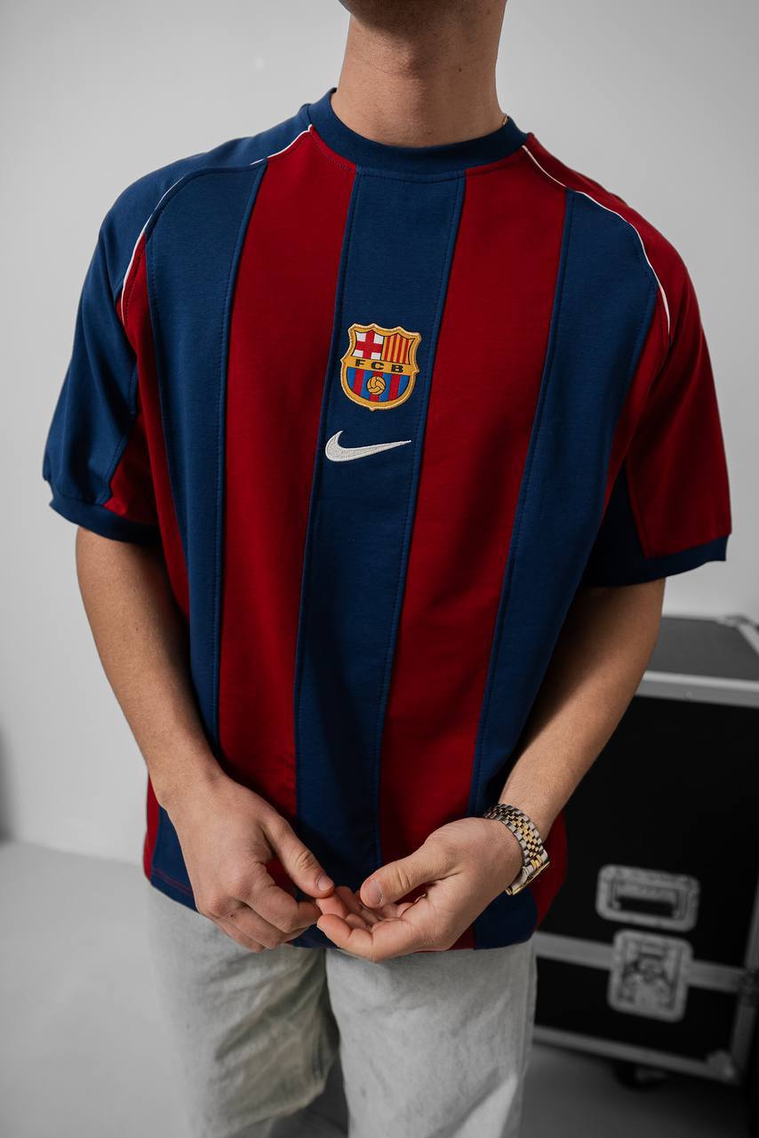 Vintage 2000-2001 Barcelona home jersey showcasing iconic blue and red Blaugrana stripes in a classic retro design.