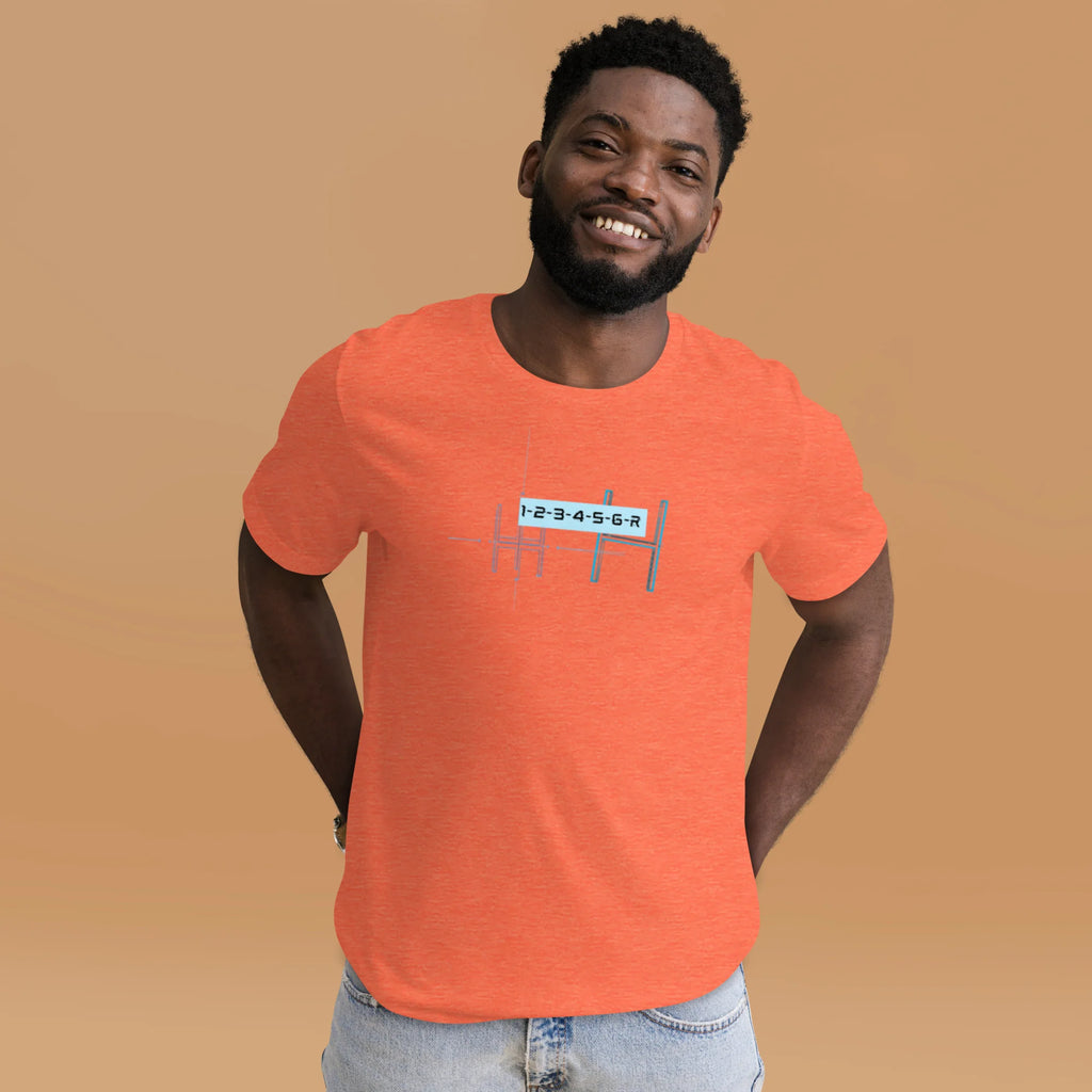 Smiling male model wearing a heather orange 6-speed manual transmission blueprint stick shift car enthusiast graphic t-shirt