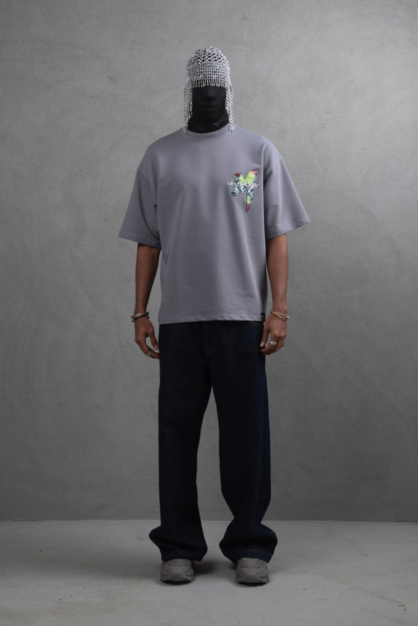 Oversize Graphic Cotton Tee – "What We Wear" Abstract Print