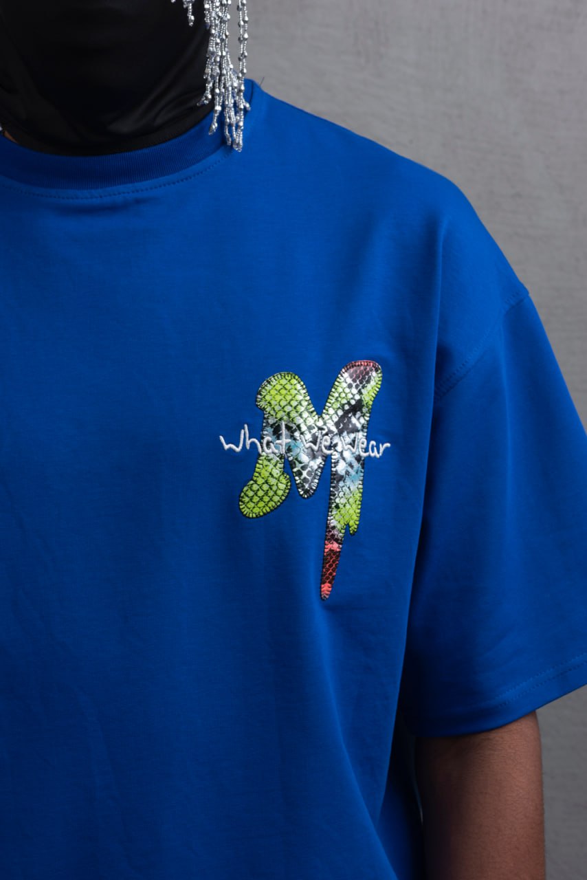 Oversize Graphic Cotton Tee – "What We Wear" Abstract Print