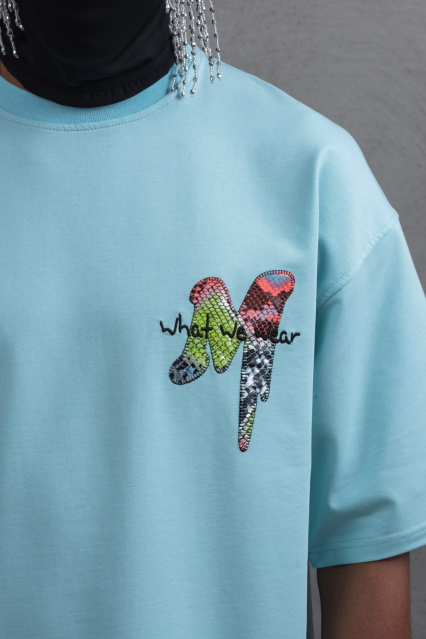 Oversize Graphic Cotton Tee – "What We Wear" Abstract Print