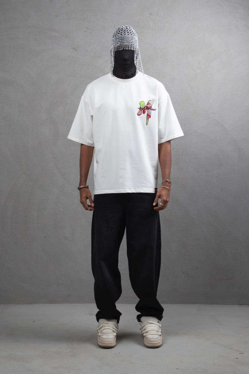 Oversize Graphic Cotton Tee – "What We Wear" Abstract Print