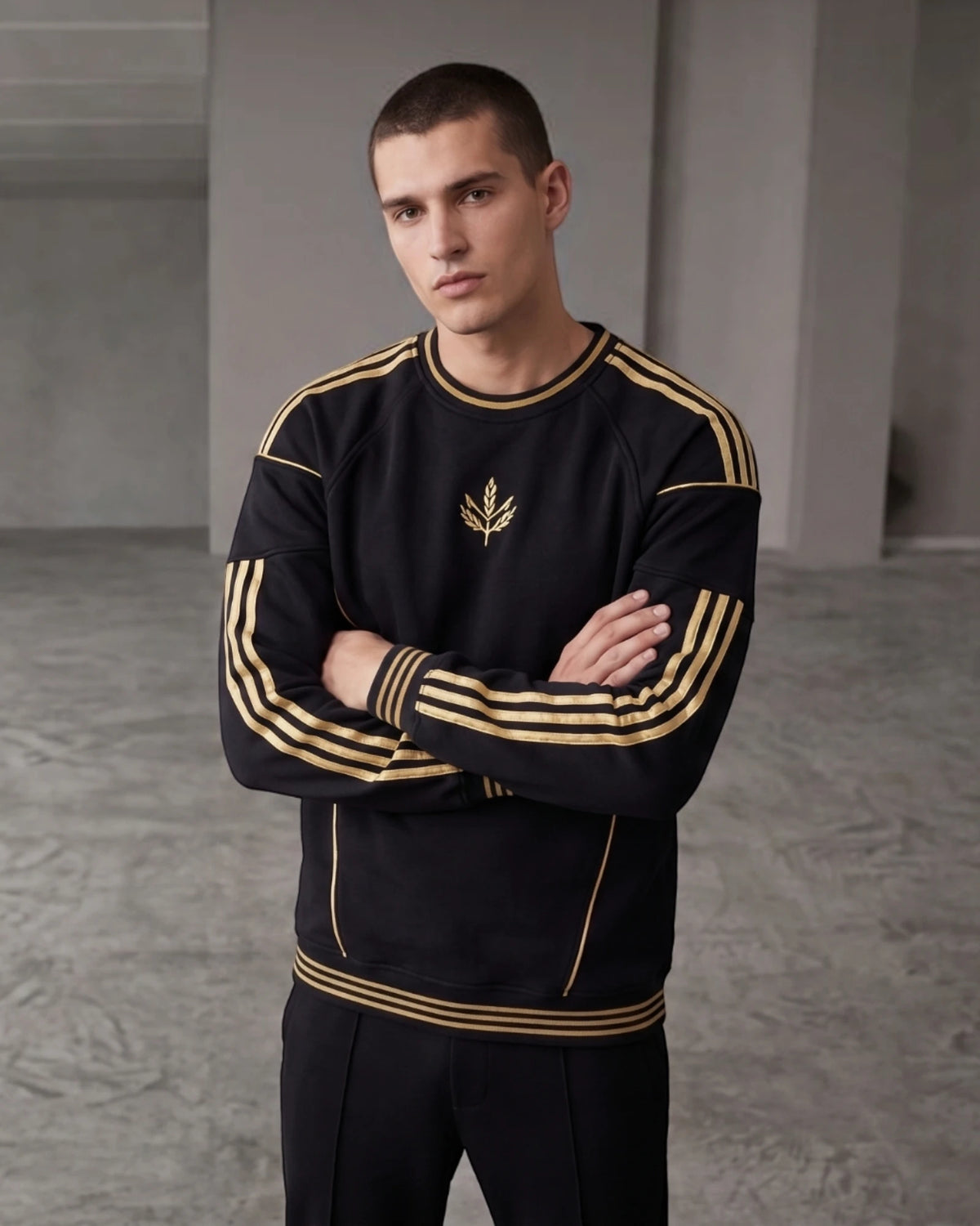 Black and gold stripe embroidered crewneck sweatshirt, front view with gold laurel emblem