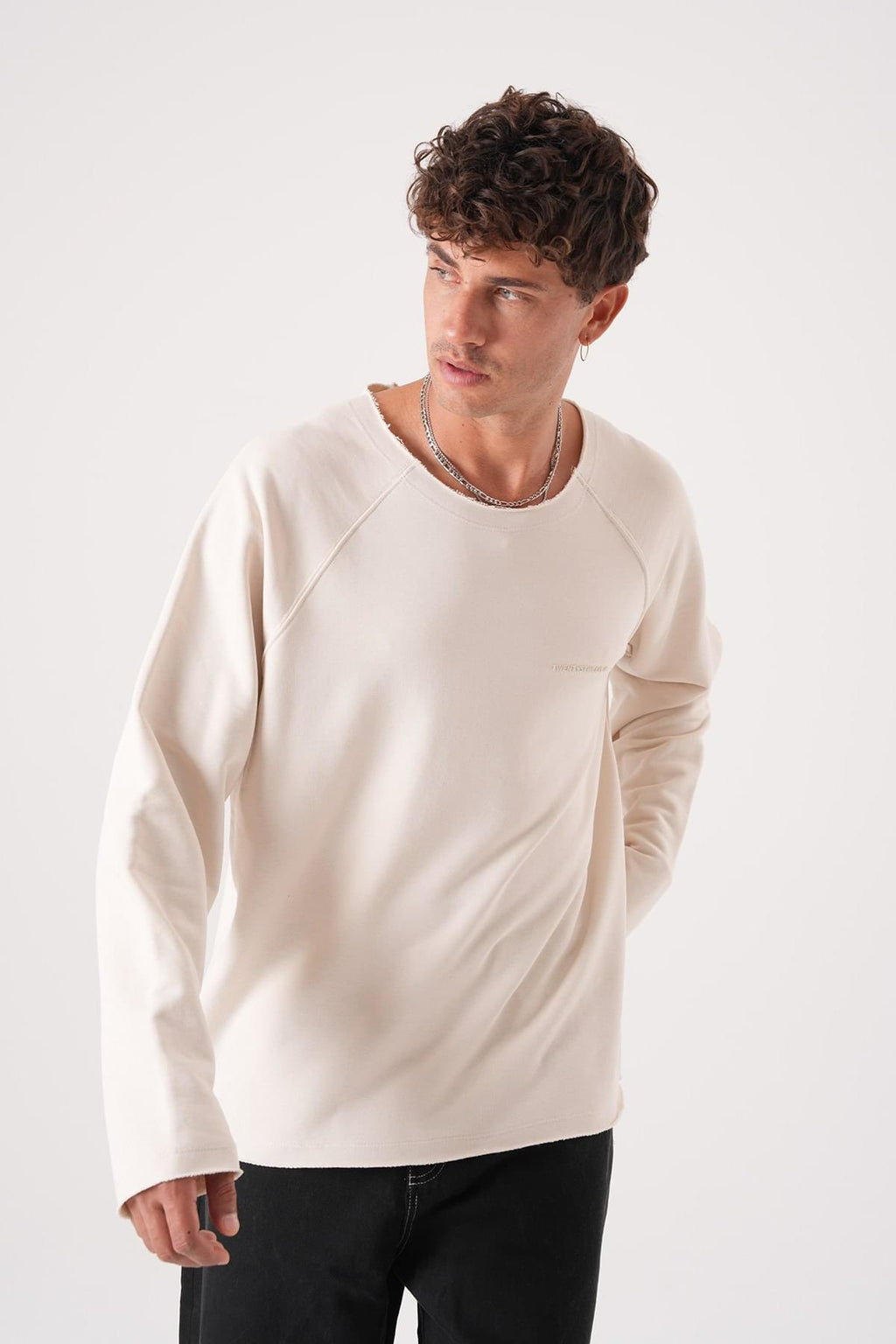 Unisex Oversized Raglan Sweatshirt - Raw Hem Detail.
