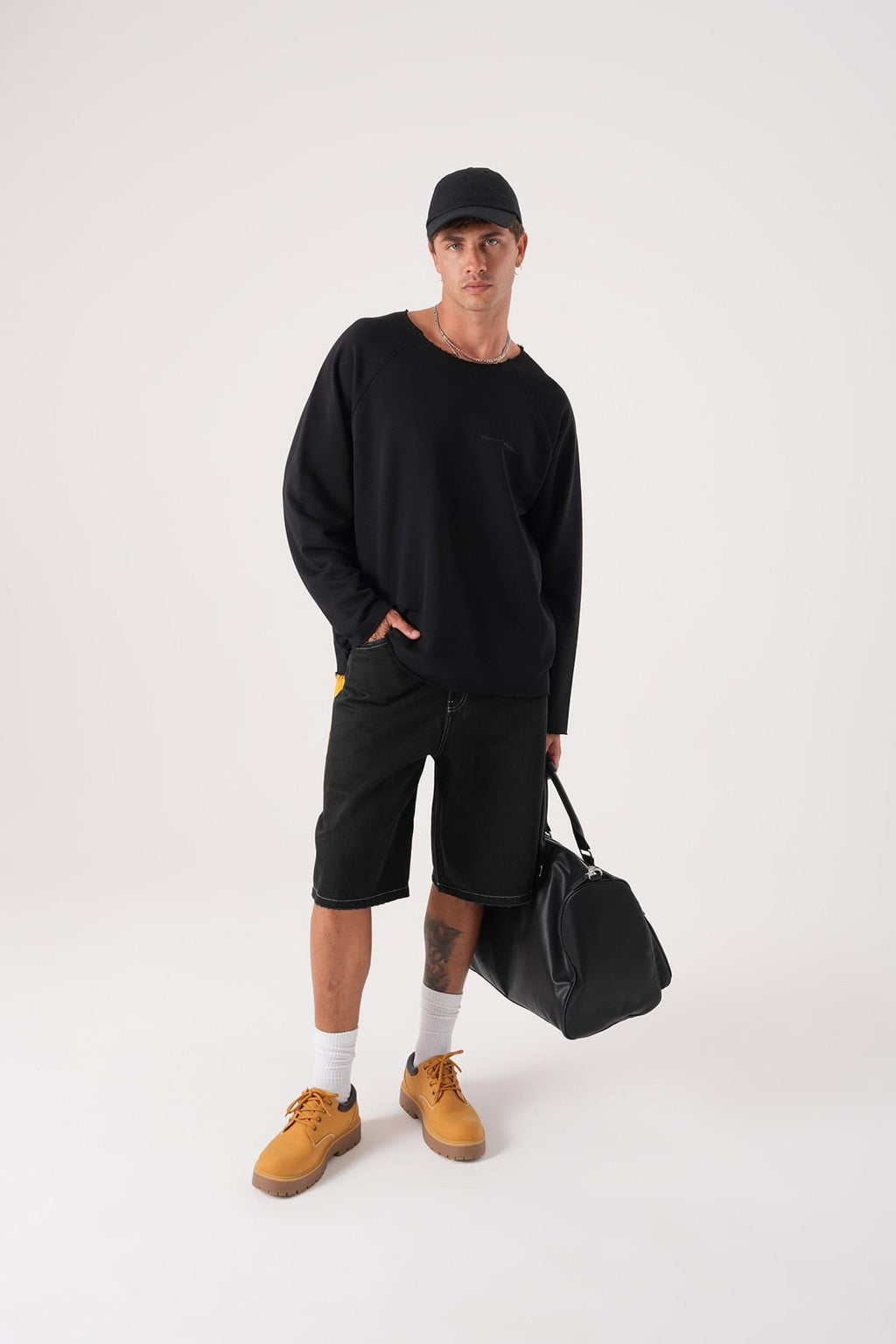 Unisex Oversized Raglan Sweatshirt - Raw Hem Detail.