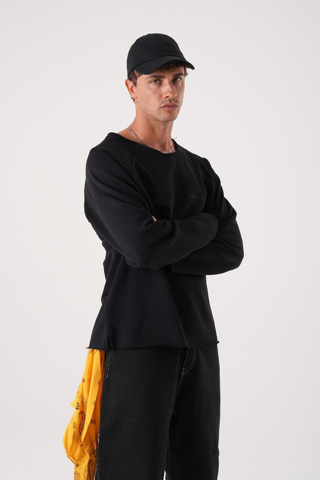 Unisex Oversized Raglan Sweatshirt - Raw Hem Detail.