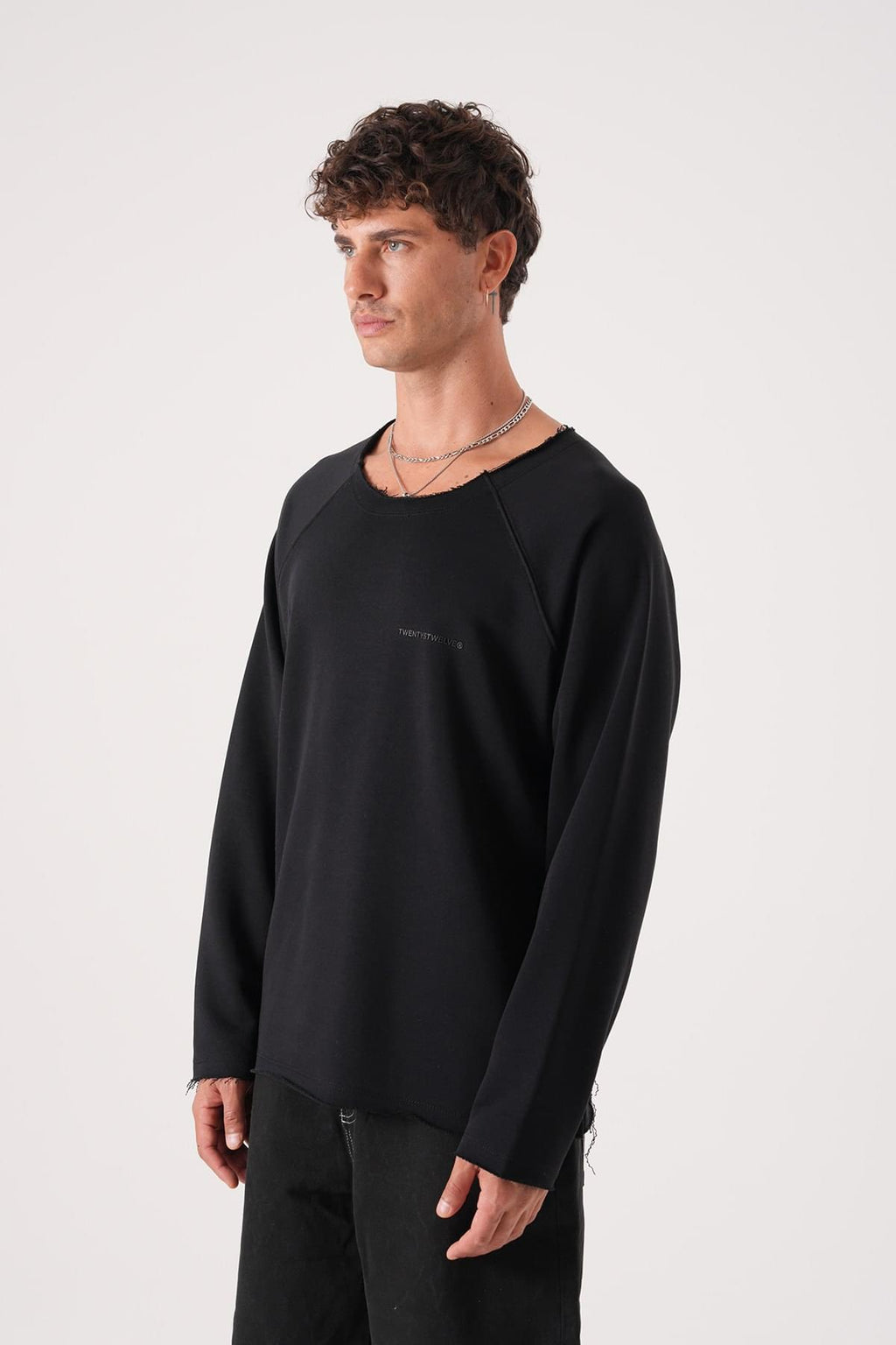 Unisex Oversized Raglan Sweatshirt - Raw Hem Detail.