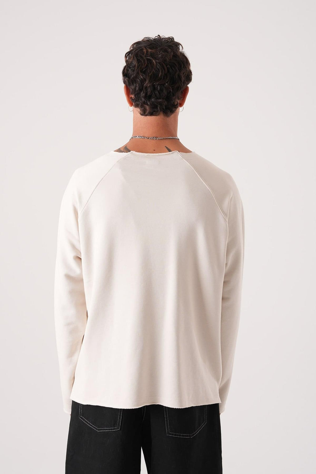 Unisex Oversized Raglan Sweatshirt - Raw Hem Detail.