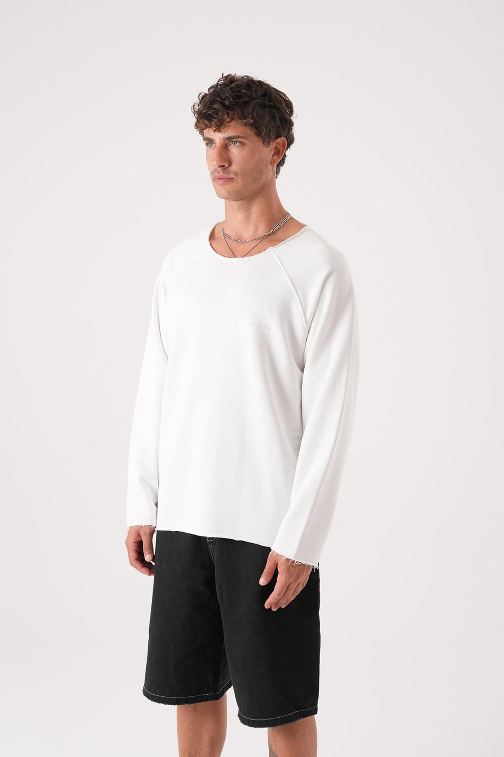 Unisex Oversized Raglan Sweatshirt - Raw Hem Detail.