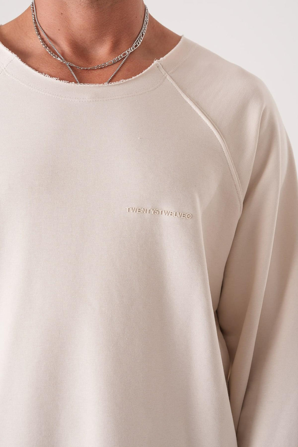 Unisex Oversized Raglan Sweatshirt - Raw Hem Detail.