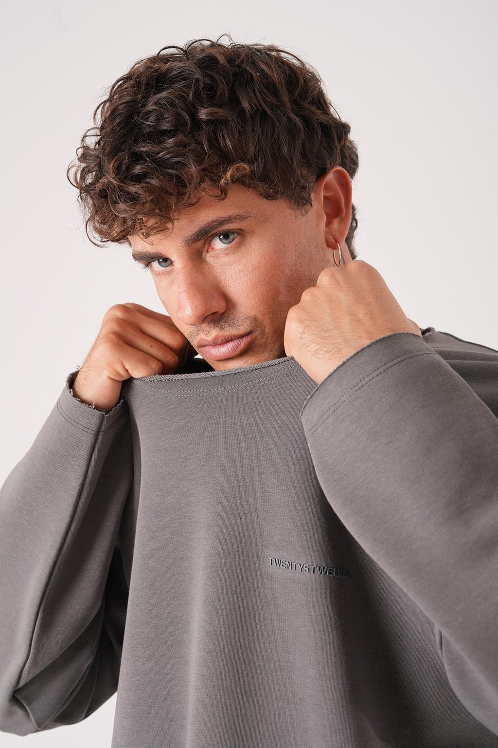 Unisex Oversized Raglan Sweatshirt - Raw Hem Detail.