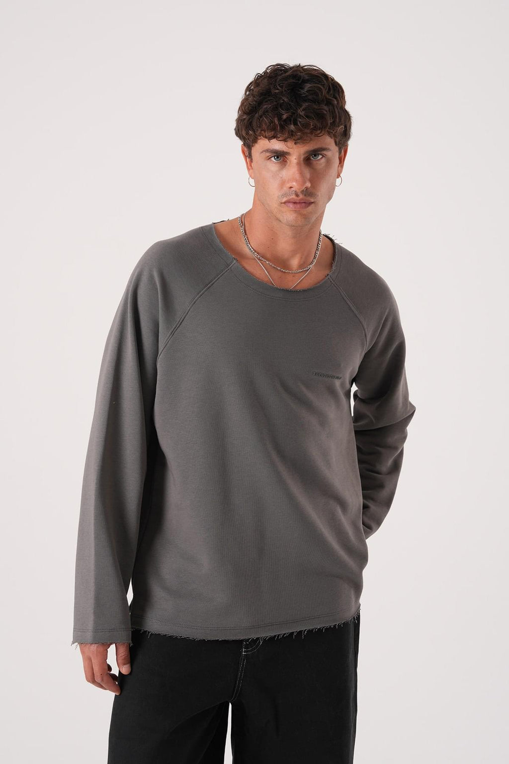 Unisex Oversized Raglan Sweatshirt - Raw Hem Detail.