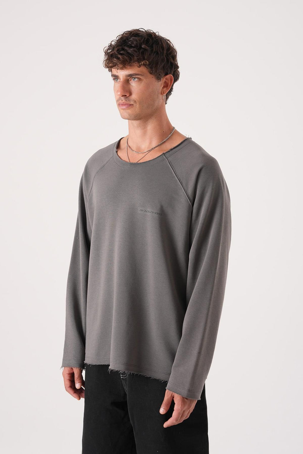 Unisex Oversized Raglan Sweatshirt - Raw Hem Detail.