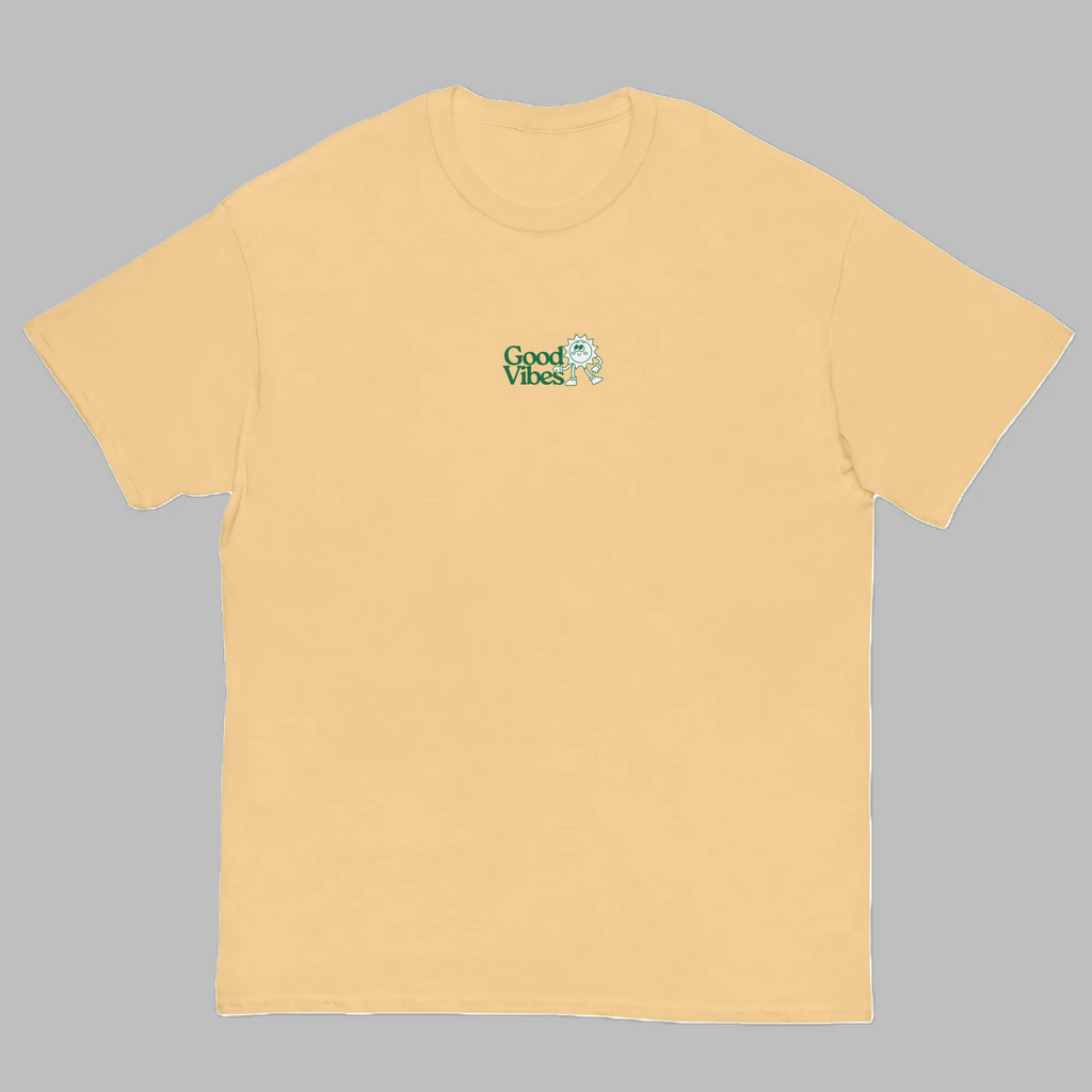 Pastel yellow crewneck t-shirt with small green Good Vibes chest logo graphic print front view