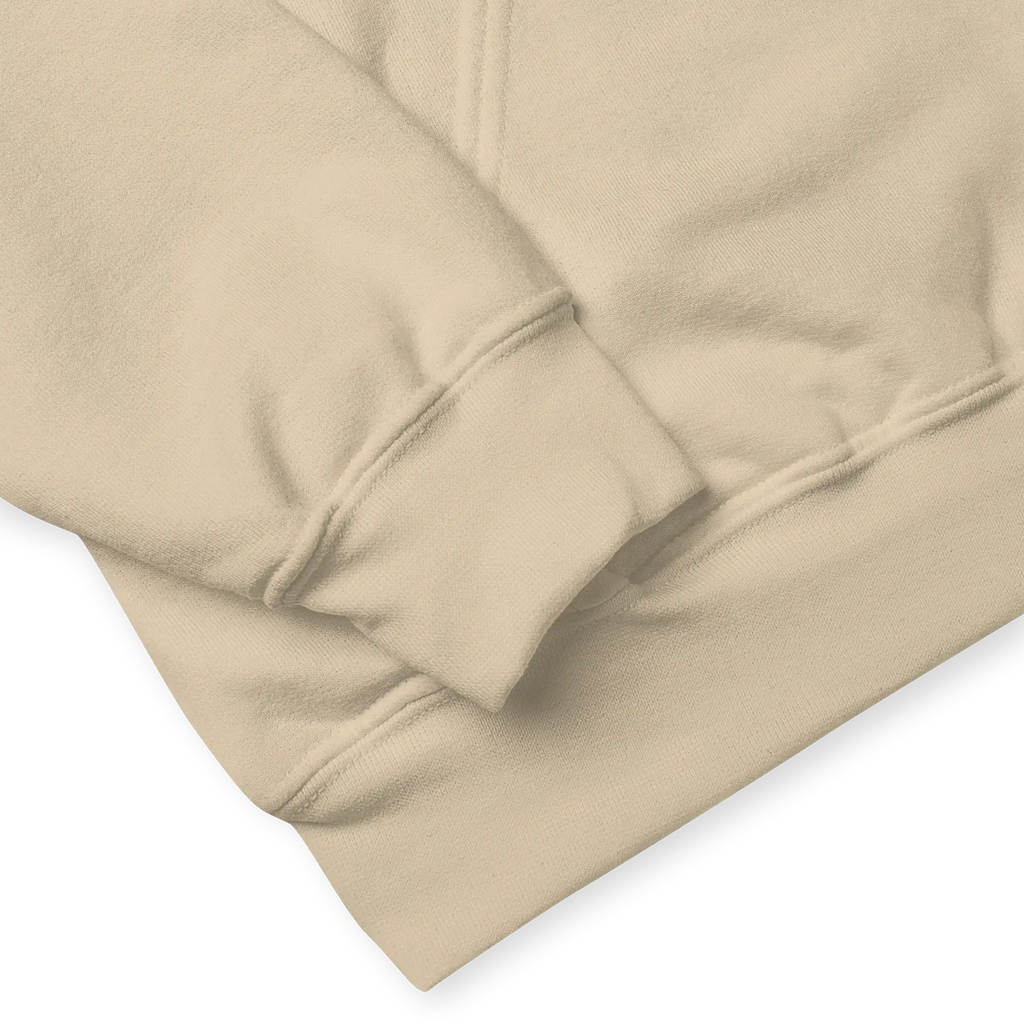 Close-up shot of sand beige hoodie fabric texture with ribbed cuff and hem stitching details