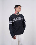 Los Angeles 17 oversized vintage football jersey sweatshirt in washed black, front, three-quarter view