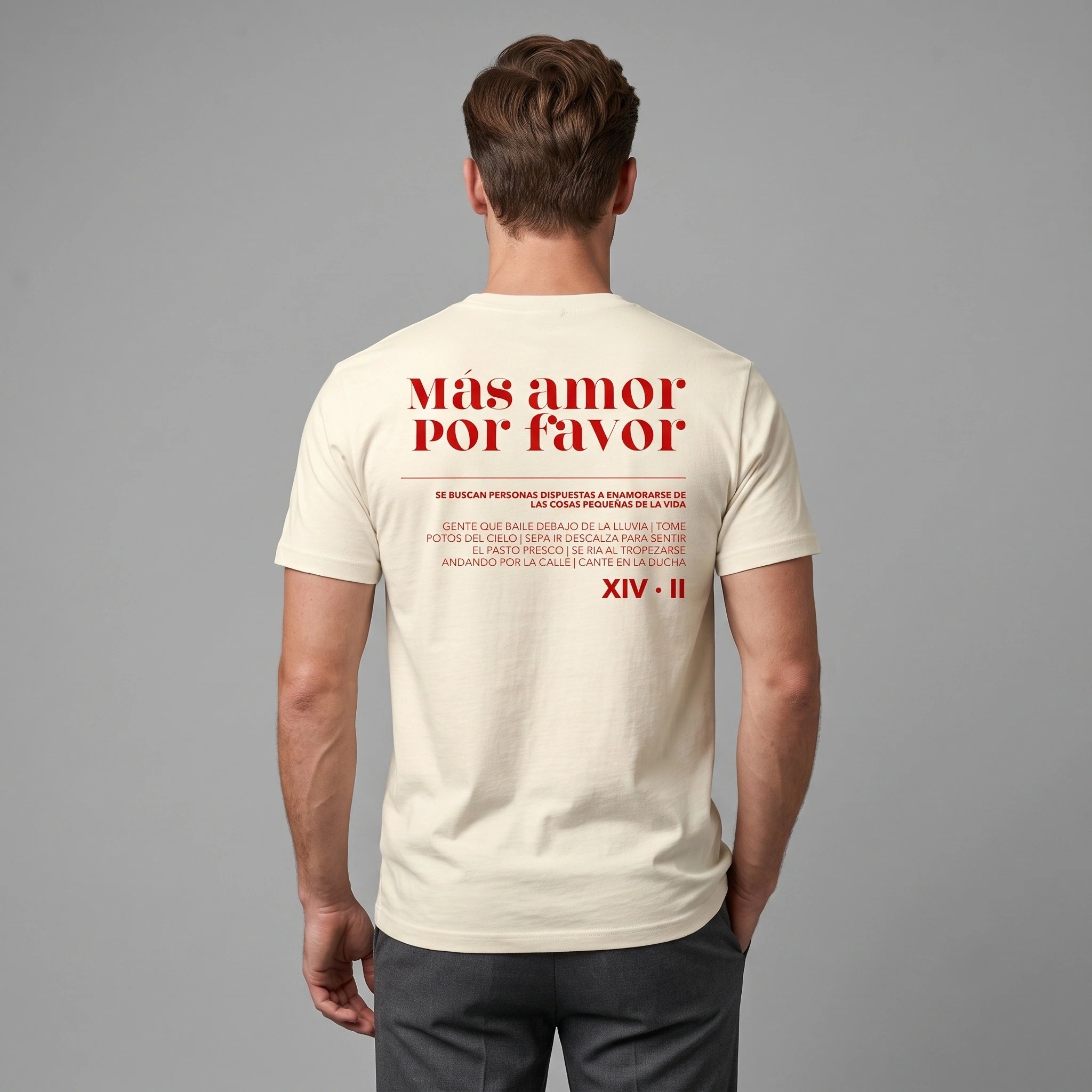 Back view of male model wearing faded cream heavyweight garment-dyed t-shirt with red Mas Amor Por Favor text print