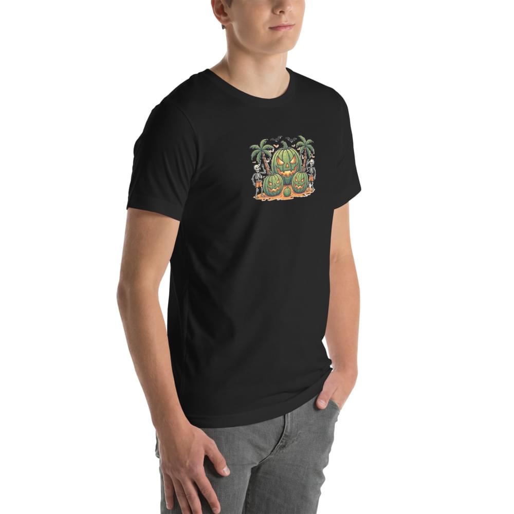 Three-quarter view of a male model wearing a black men's Summerween graphic t-shirt. The shirt features a tropical watermelon jack-o'-lantern and skeletons design, styled with grey jeans against a white background.