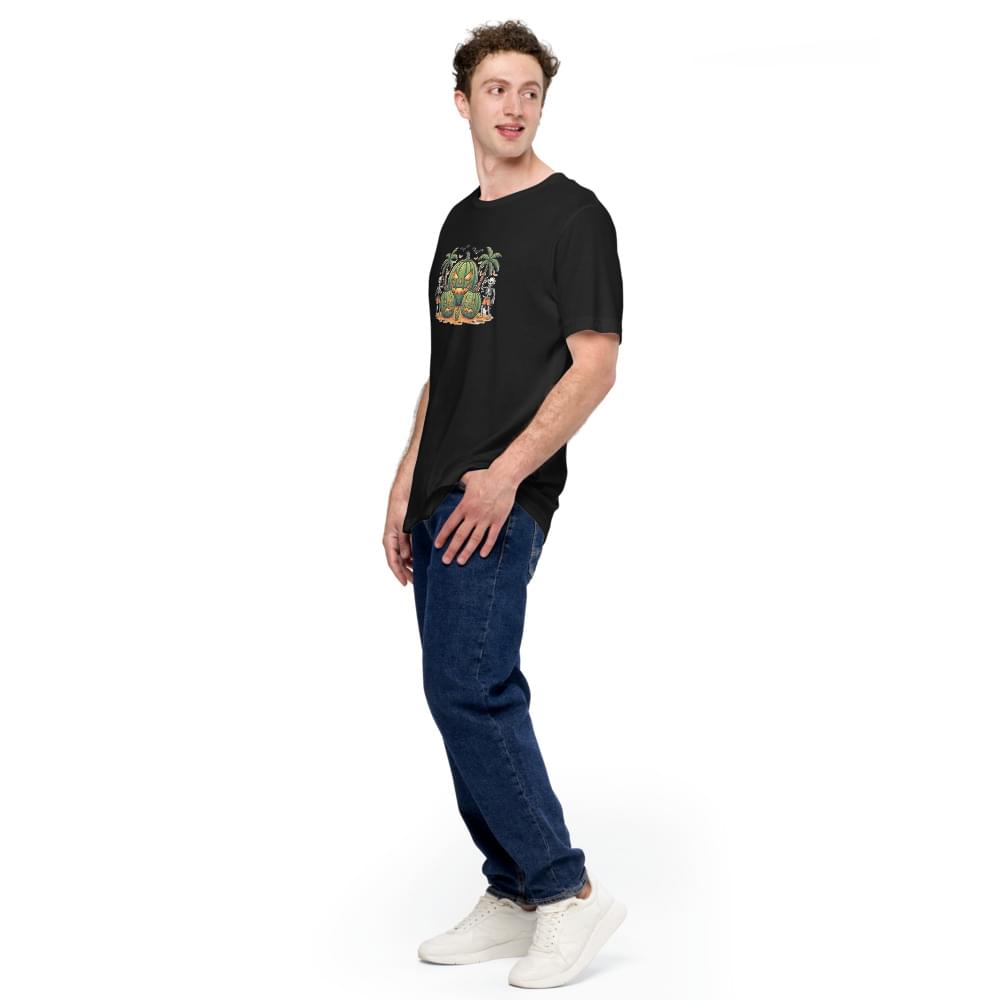 Side view of a male model wearing a black men's Summerween graphic tee with a tropical watermelon jack-o'-lantern design, styled with blue jeans and white sneakers.