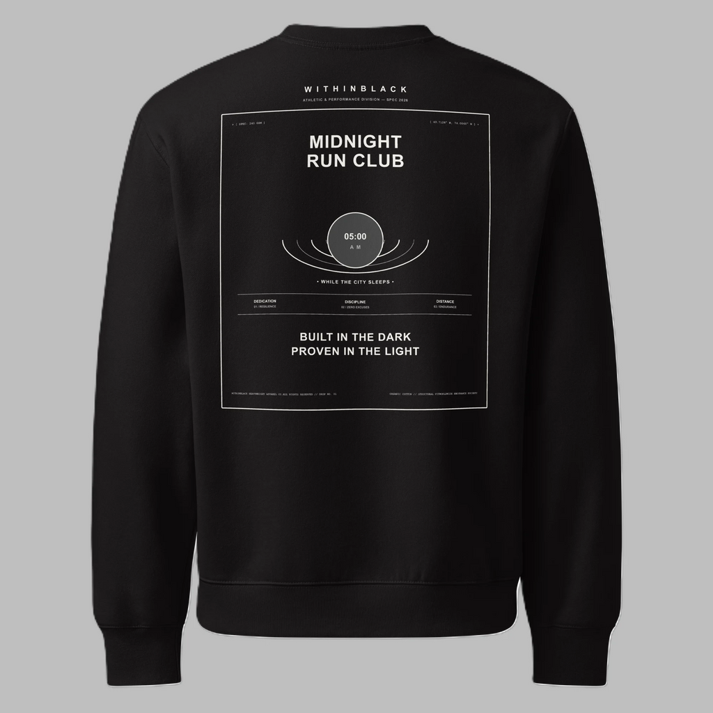Back flat lay view of a black crewneck sweatshirt against a grey background, featuring a white rectangular graphic on the back with 'WITHINBLACK', 'MIDNIGHT RUN CLUB', a central moon graphic with '05:00 AM', and the text 'BUILT IN THE DARK PROVEN IN THE LIGHT'.