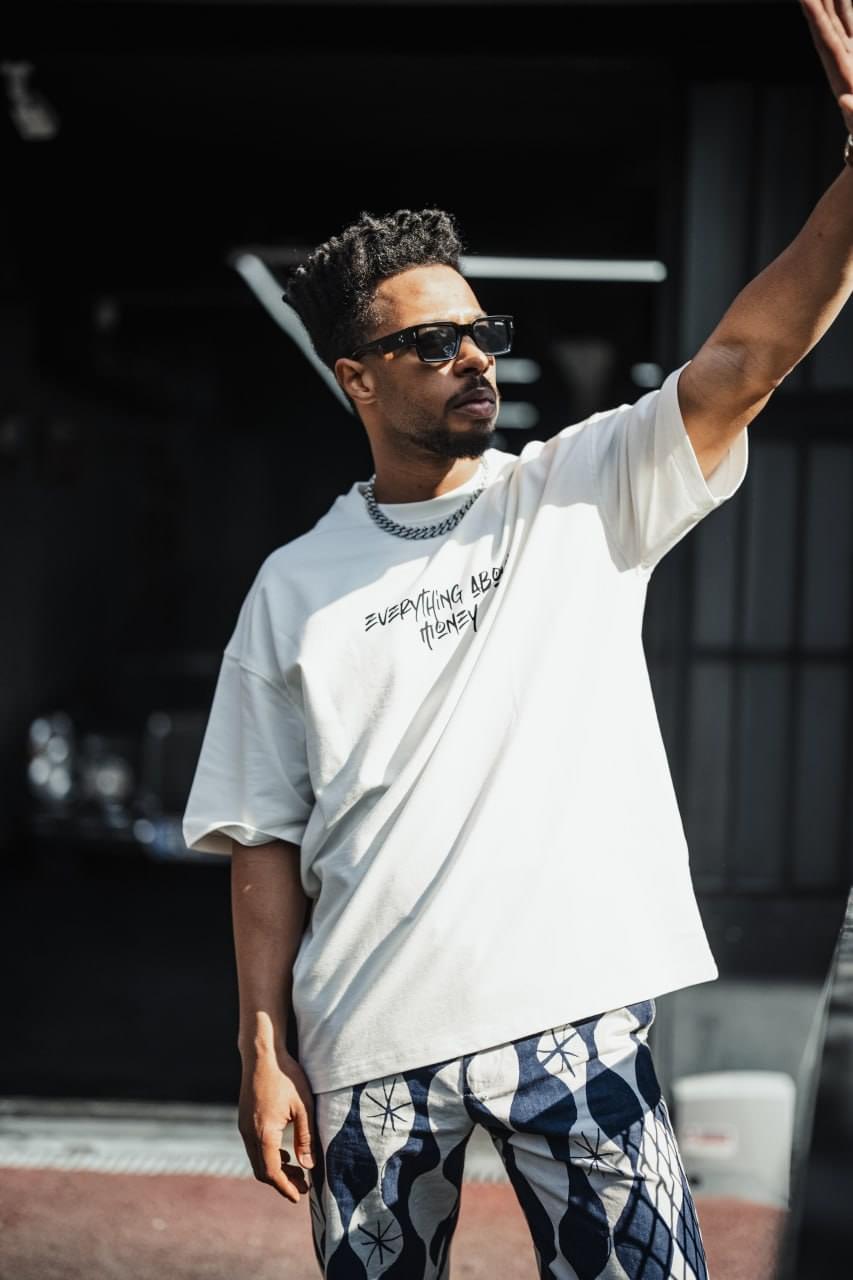 Everything About Money Urban Graphic Tee – Bold Typography Streetwear for the Hustle.