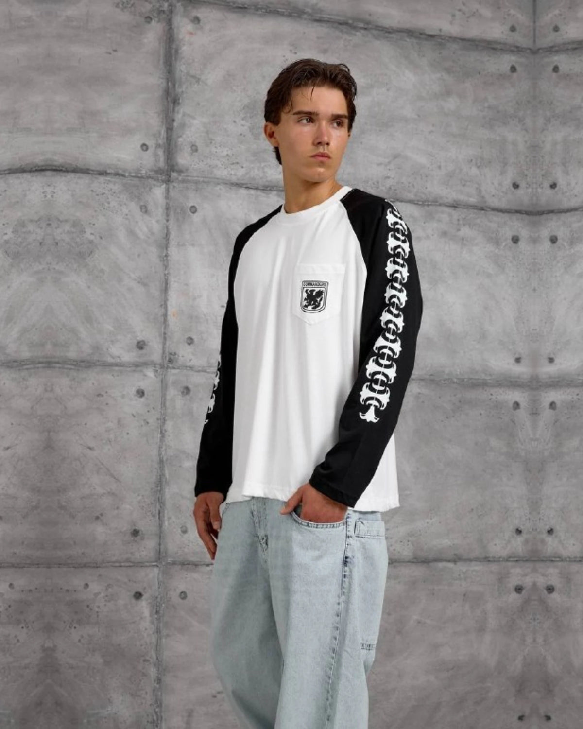 Gothic Sleeve Crest Pocket Raglan Sweatshirt in Black by Withinblack