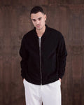 Oversized Laminated Chenille Varsity Jacket in black, photo 1