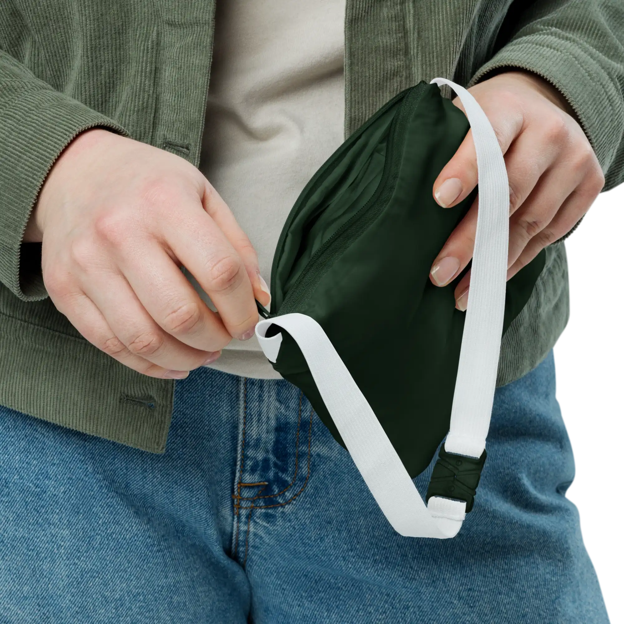 Close-up of packable forest green windbreaker pouch with white carrying strap and zipper detail