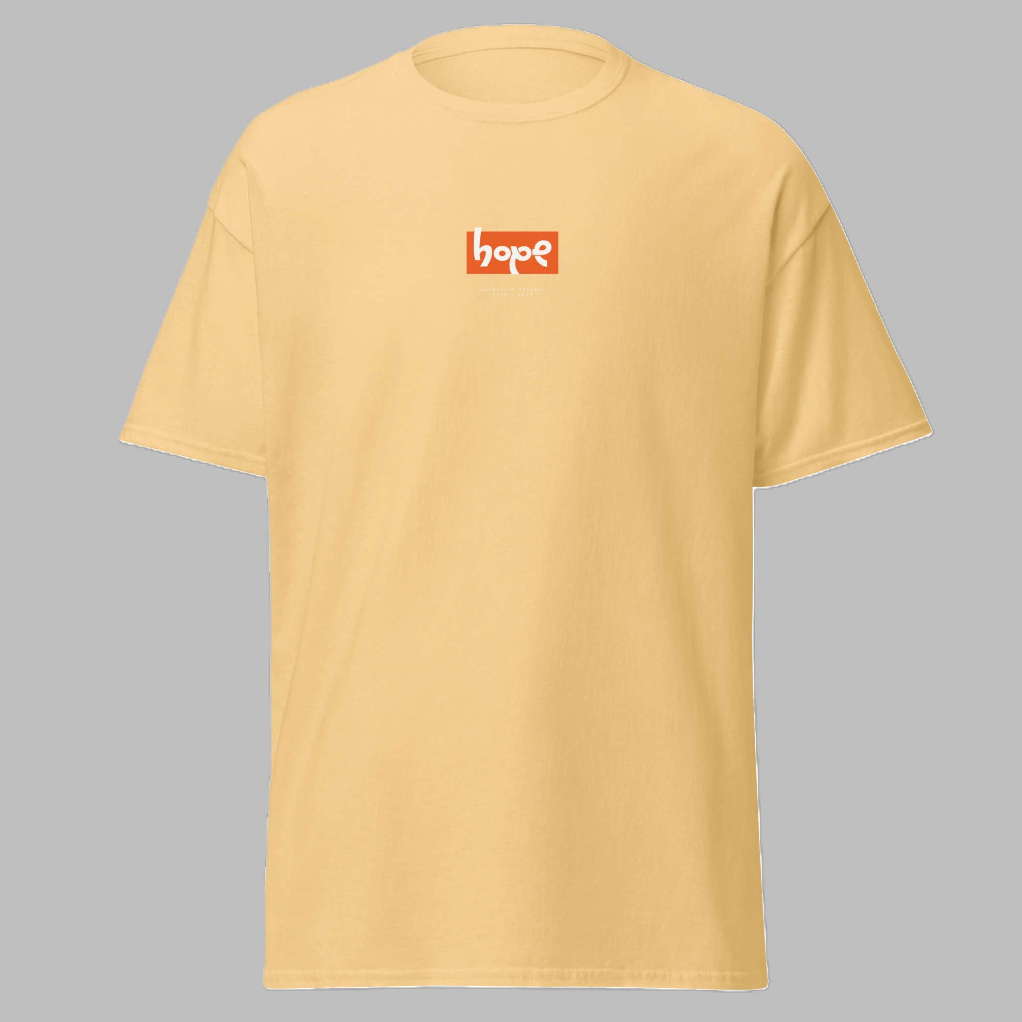 Front angled view of a pastel yellow crewneck t-shirt featuring an orange 'hope' box logo on the chest.