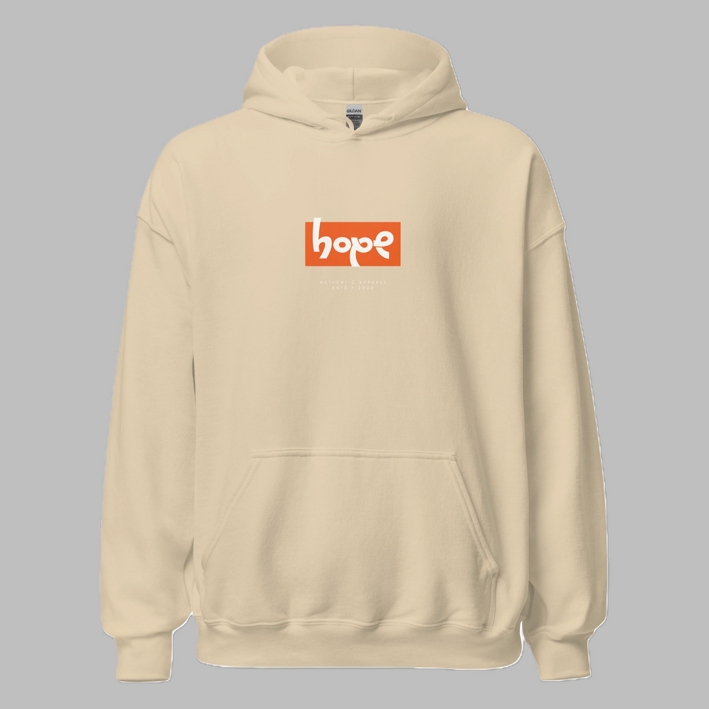 Front view of a sand-colored pullover hoodie with a central orange box logo containing the white text 'hope'. Perfectly legible subtext below reads: 'ESTABLISHED IN 2023 / SYMBOL OF RESILIENCE'. Detailed fabric texture and clean stitching visible against a light grey background.