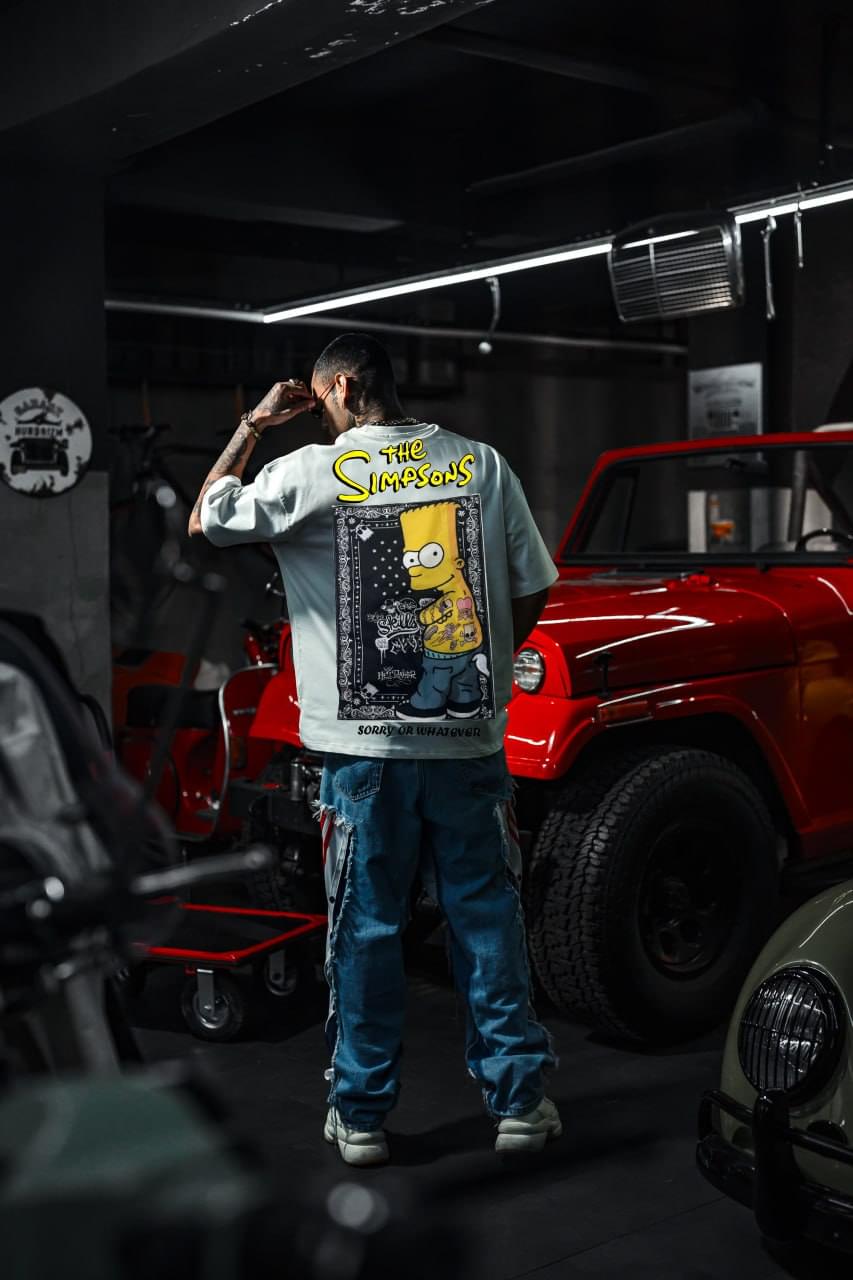 Mischief Icon Men's Graphic Tee – Tattooed Character Streetwear with Attitude.
