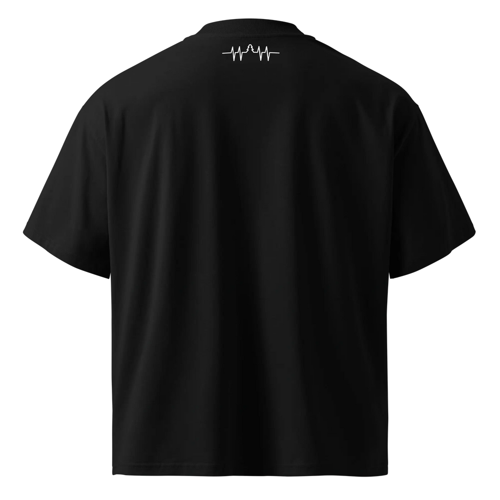 Back flat view of the oversized black organic cotton t-shirt. The upper back features a minimalist white heartbeat and tree line graphic just below the collar.