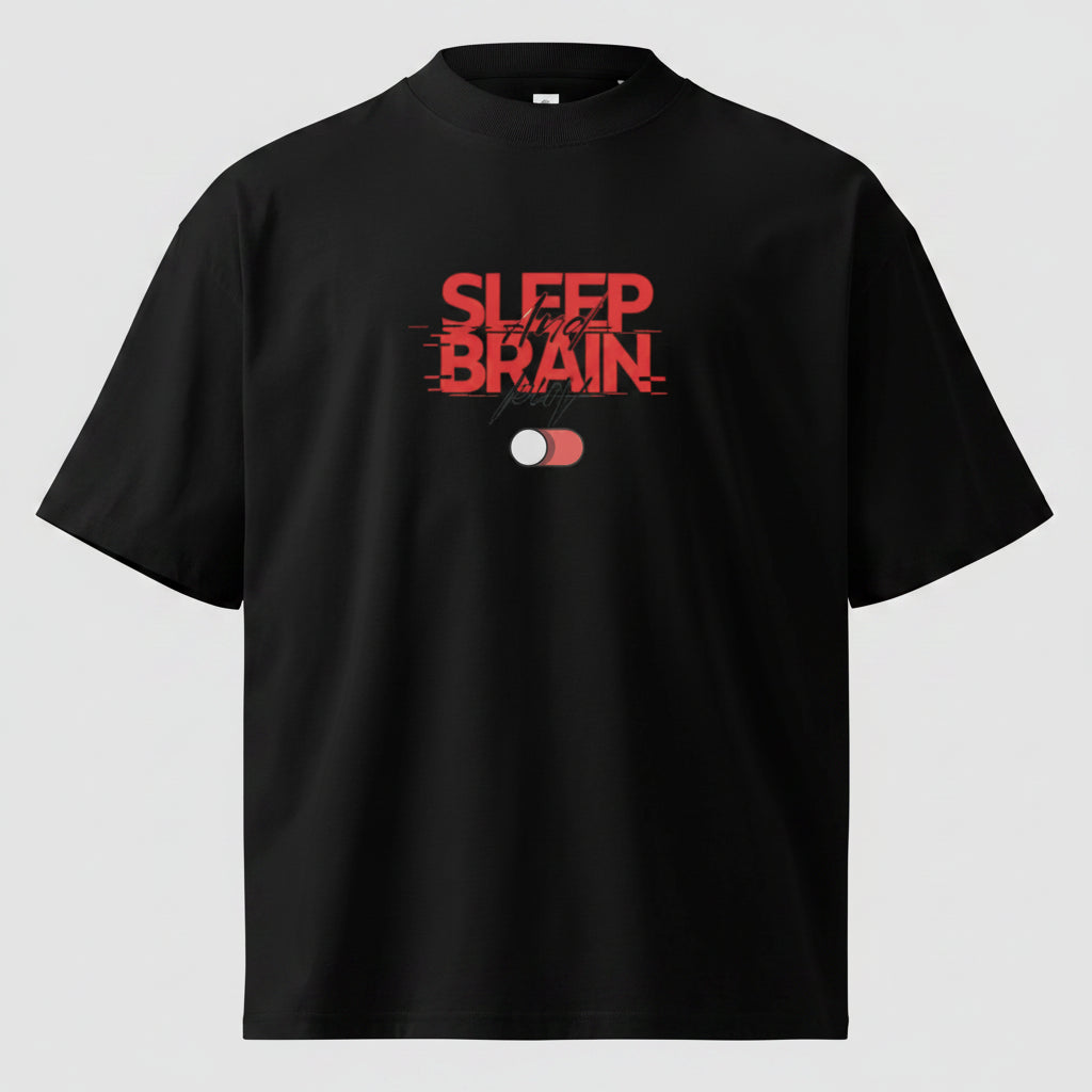 Front flat view of the oversized black organic cotton t-shirt. The chest features the prominent red Sleep and Brain typography with a toggle switch graphic.