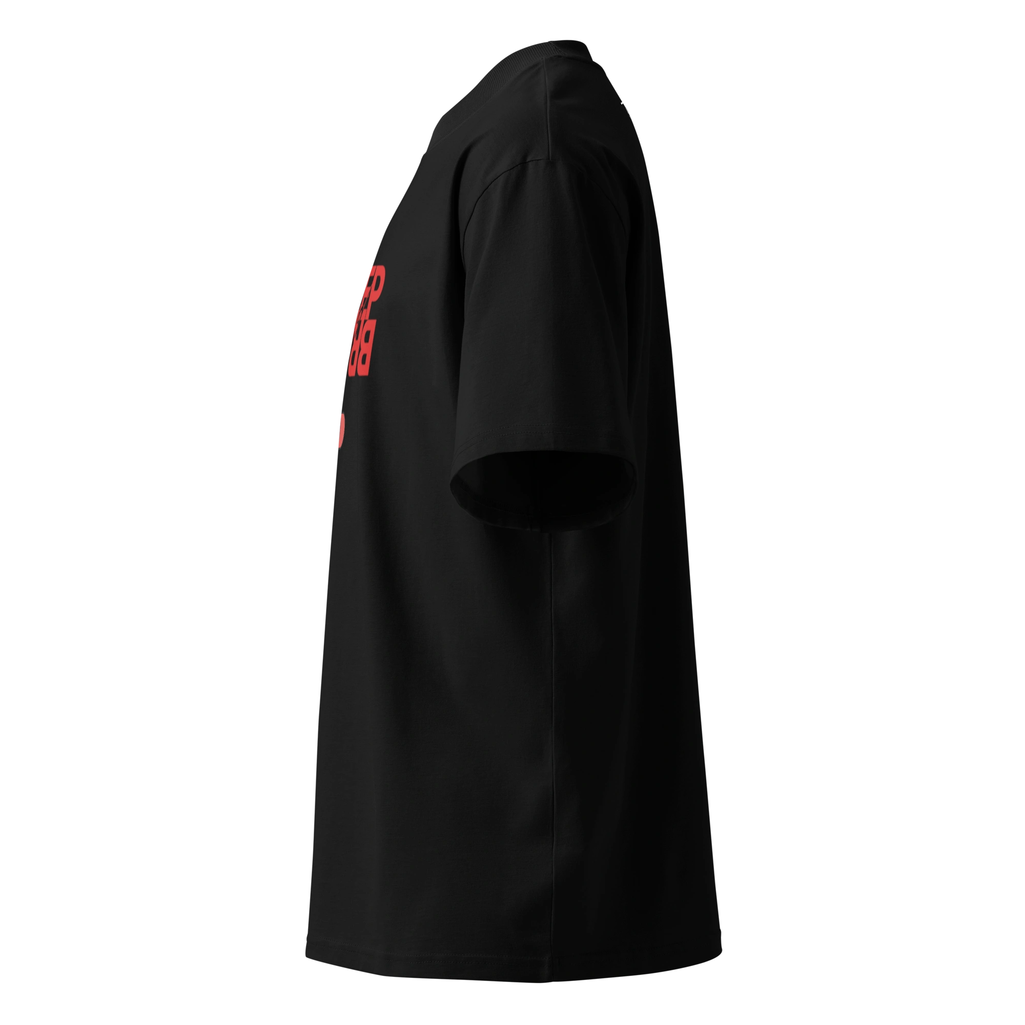 Side profile view of the oversized black organic cotton t-shirt, showcasing the relaxed drop-shoulder fit and a partial view of the red front graphic.