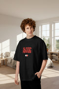Man wearing an oversized black organic cotton t-shirt with a red Sleep and Brain toggle switch graphic on the front.