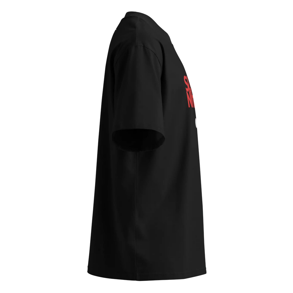 Left side profile view of the oversized black organic cotton t-shirt, displaying the wide sleeve design and a partial view of the red front graphic.