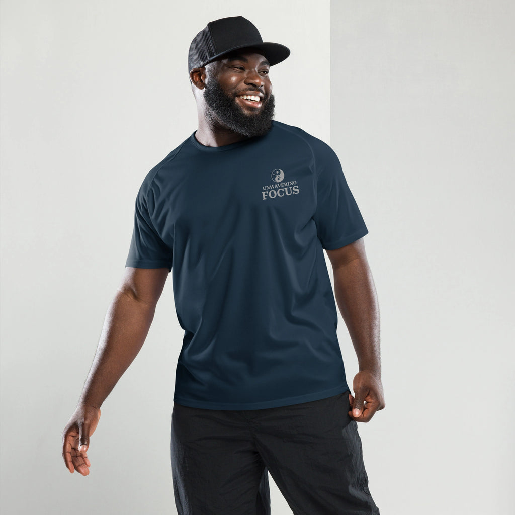 Front view of a man wearing a french navy blue sports shirt with the unwavering focus logo.