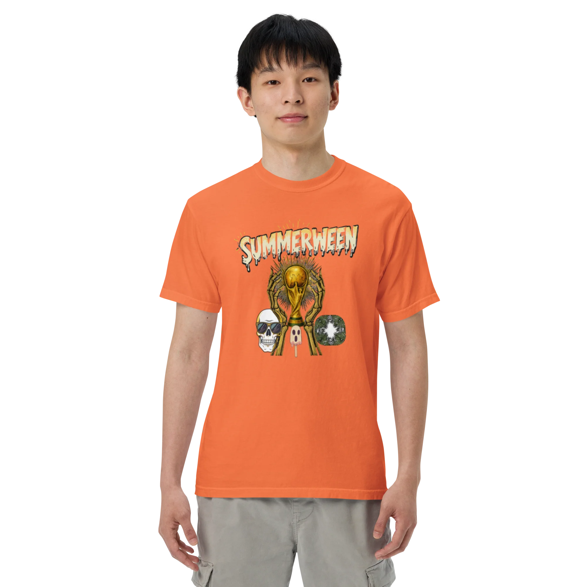 Male model wearing a burnt orange heavyweight t-shirt with a Summerween skeleton and golden trophy graphic, front view