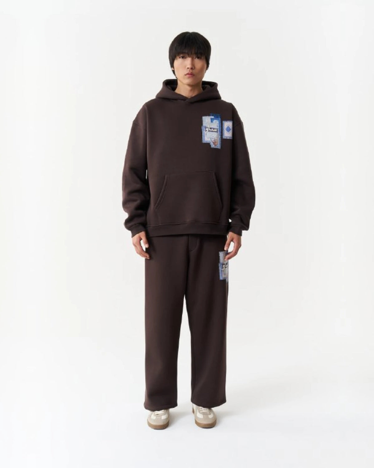 Blue Rug Patchwork Arabic Script Oversized Hoodie in Brown - front view