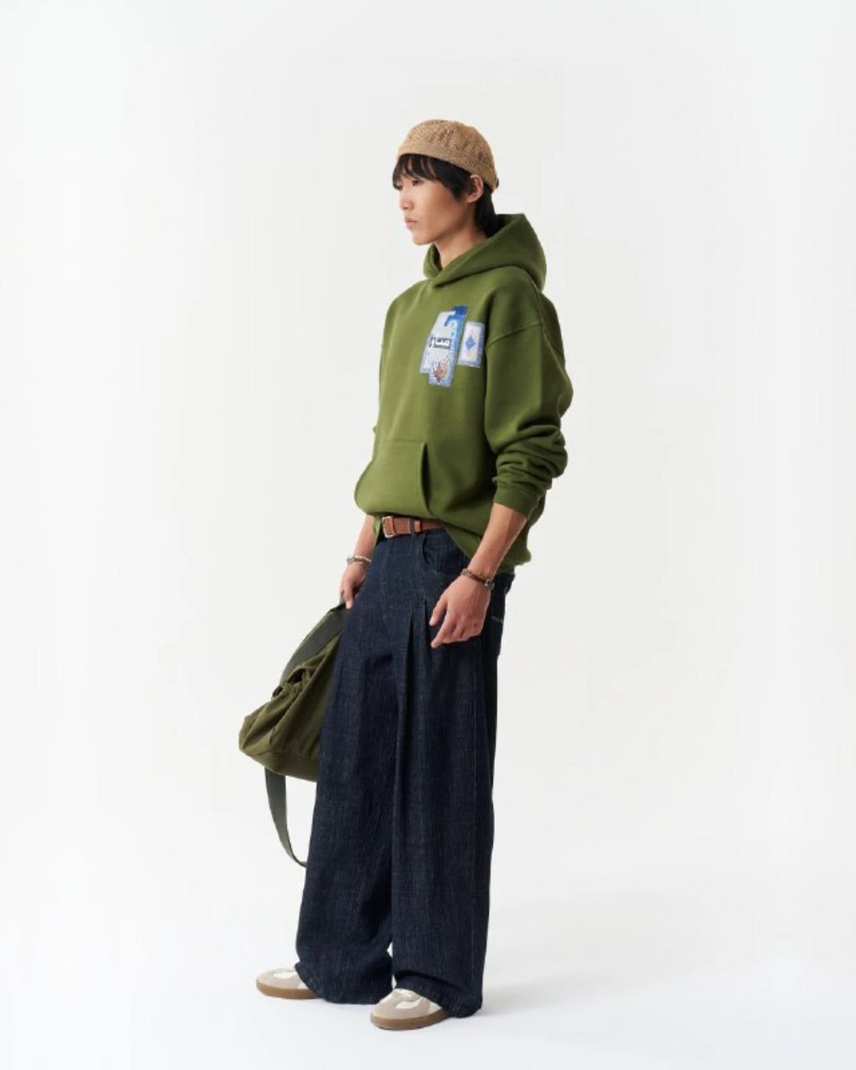 Blue Rug Patchwork Arabic Script Oversized Hoodie in Green - front view