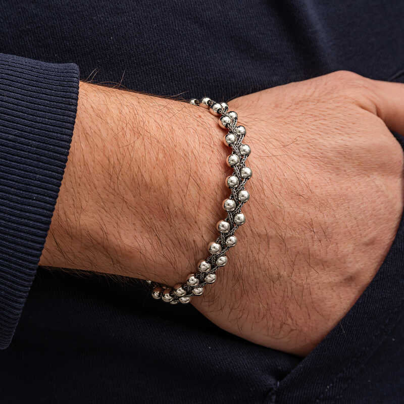 Heavy oxidized silver beaded bracelet for men styled with streetwear