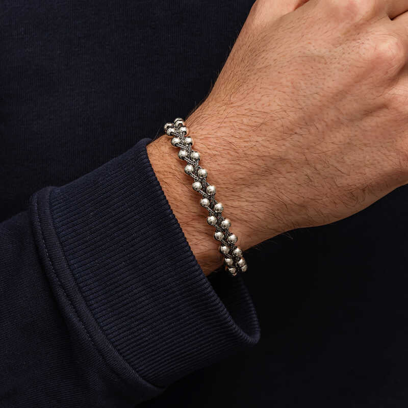 Men's 925 sterling silver ball chain bracelet with oxidized finish, side view on wrist