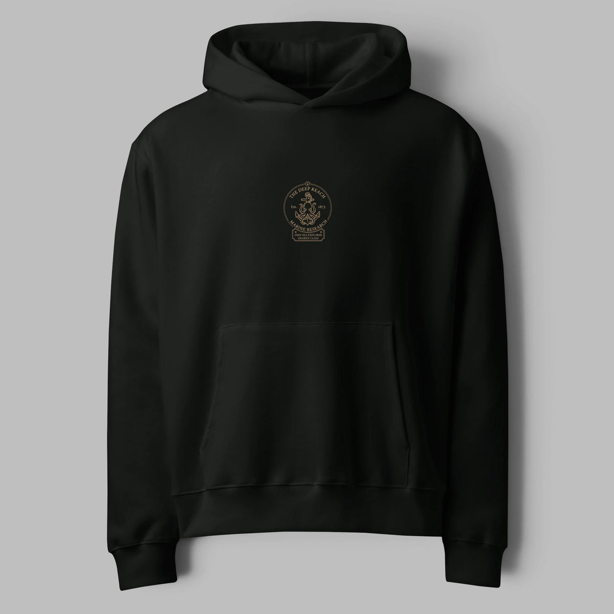 Flat lay front view of a washed vintage black oversized hoodie featuring a minimal center graphic print and pouch pocket