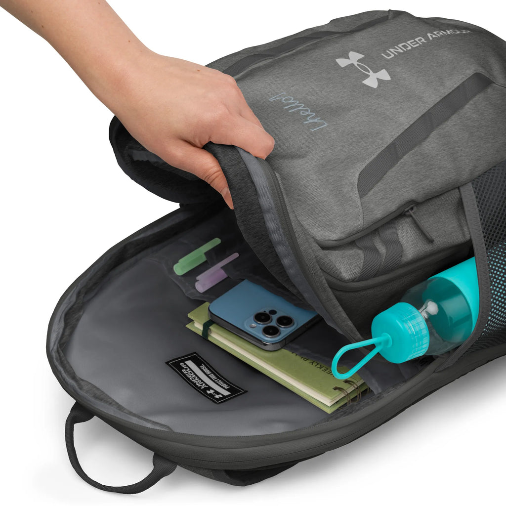 Under Armour UA Storm Commuter Backpack in Castlerock grey, showing the open front zippered compartment with slots for phone and notebooks.