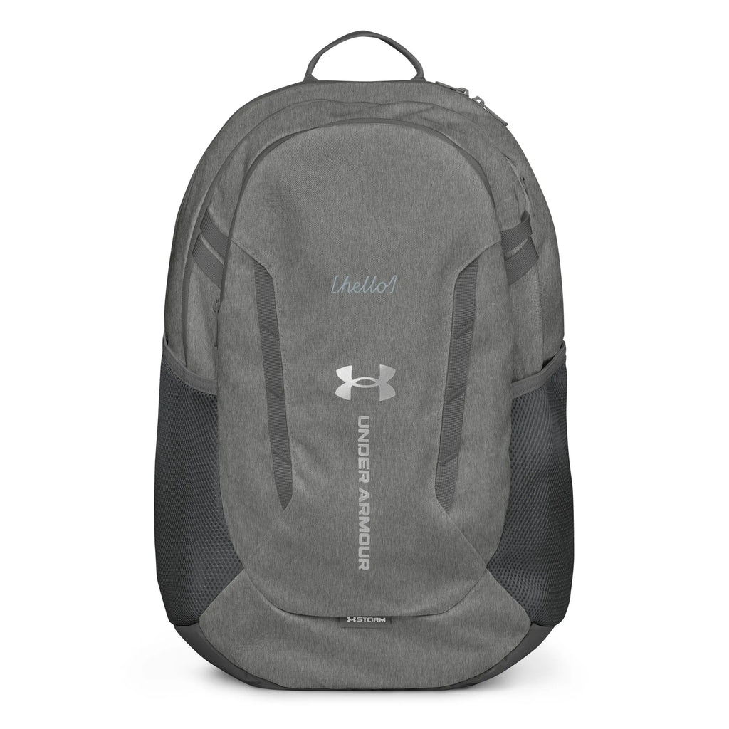 Under Armour UA Storm Commuter Backpack in Castlerock grey, front view displaying the water-resistant fabric and center logo.
