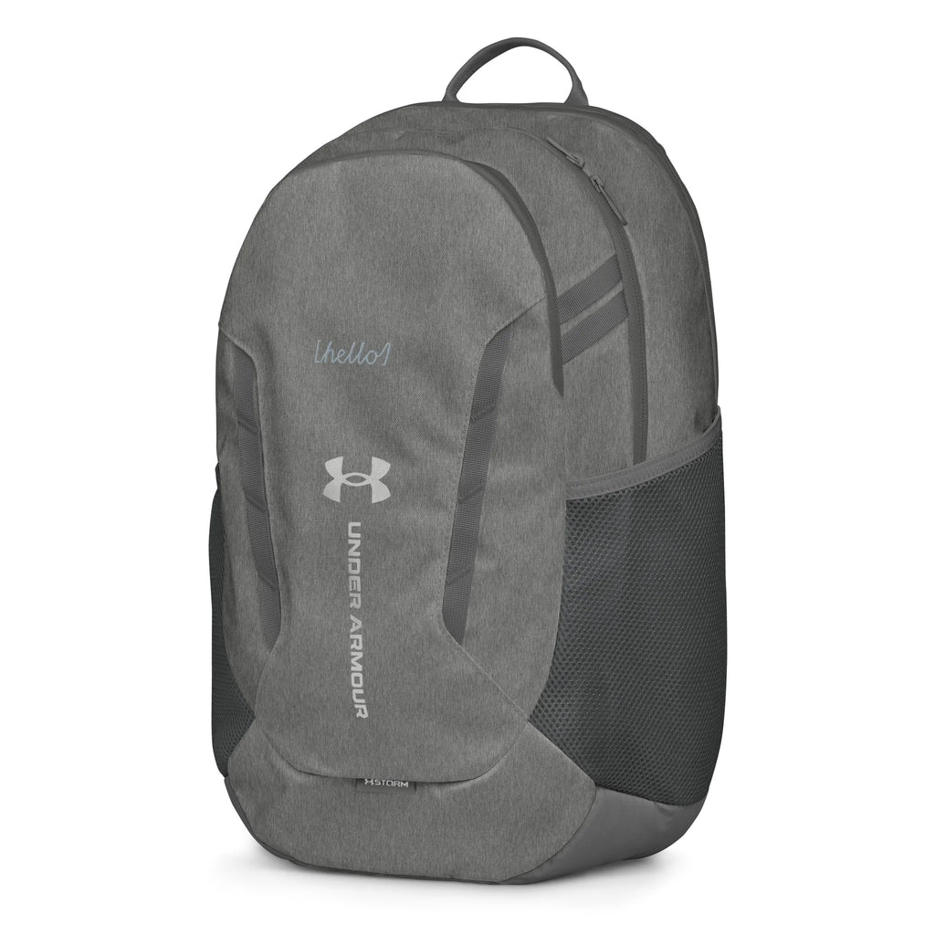 Under Armour UA Storm Commuter Backpack in Castlerock grey, left side view showcasing the side profile and mesh water bottle pocket.